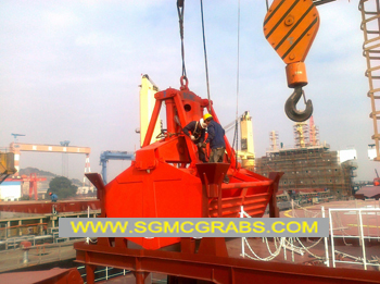 Motor hydraulic clamshell grab
